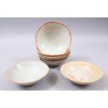 EIGHT EARLY CHINESE POTTERY GLAZED BOWLS, some glazed, some partially glazed, various sized but