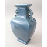 A GOOD CHINESE PALE BLUE TIN HANDLE PORCELAIN VASE, the tapered vase with twin moulded handles,