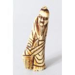 A JAPANESE EDOI PERIOD CARVED STAG ANTLER NETSUKE OF GENKEI SENNIN, the sennin stood holding a