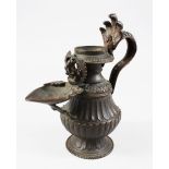 A FINE QUALITY 17TH / 198TH CENTURY NEPALESE BRONZE OIL LAMP, 21.5cm high x 20.5cm wide.