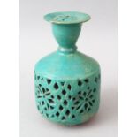 AN EARLY KASHAN TURQUOISE GLAZED TERRACOTTA WATER SPRINKLER, with pierced decoration, 16cm high.