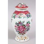 A CHINESE 19TH CENTURY FAMILLE ROSE PORCELAIN TEA CADDY, decorated with floral design, 13cm high.