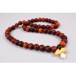 A CHINESE HORN BEAD NECKLACE / ROSARY BEADS , comprising of 54 spherical beads approx 1.1cm, with