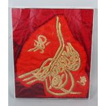 A GOLD THREAD EMBROIDERED CALLIGRAPHY PANEL, 38cm x 31.5cm.