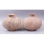 A PAIR OF UNUSUAL EARLY CHINESE BARREL SHAPED TERRACOTTA BURIAL URNS, with broad circular shaped