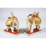 TWO 19TH CENTURY INDIAN CARVED AND PAINTED ALABASTER ELEPHANTS AND RIDERS, 13.5cm high x 12cm wide.