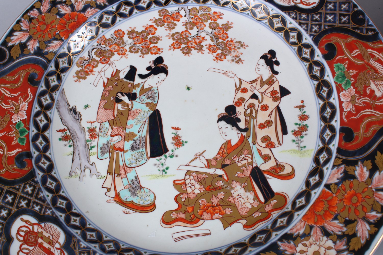 A GOOD PAIR OF JAPANESE MEIJI PERIOD IMARI PORCELAIN CHARGERS, decorated with scenes of girls in - Image 2 of 7