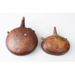 TWO 18TH/19TH CENTURY PERSIAN LEATHER POWDER FLASKS, with embossed and incised decoration, 19cm