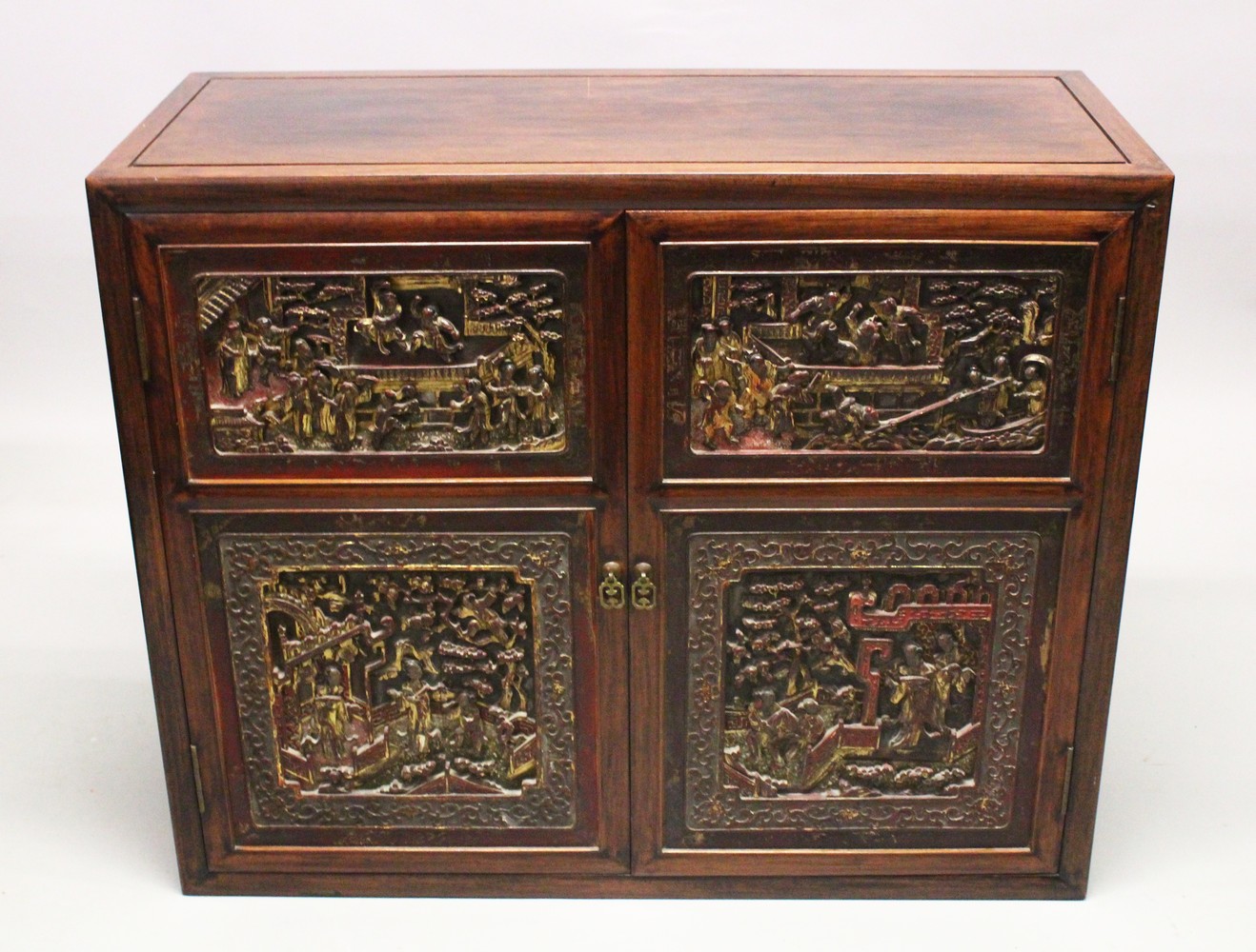 A GOOD 19TH CENTURY CHINESE HARDWOOD CABINET, the cabinet with two large carved and gilded doors,