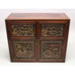 A GOOD 19TH CENTURY CHINESE HARDWOOD CABINET, the cabinet with two large carved and gilded doors,