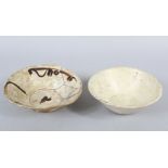 TWO VERY EARLY NISHABOUR POTTERY BOWLS, 15.5cm and 17cm wide, (a.f.) (2).
