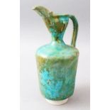 A VERY EARLY KASHAN TURQUOISE POTTERY EWER, 27cm high.
