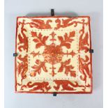 A SPANISH CERAMIC TILE, with lustre decoration, 30cm x 30cm.