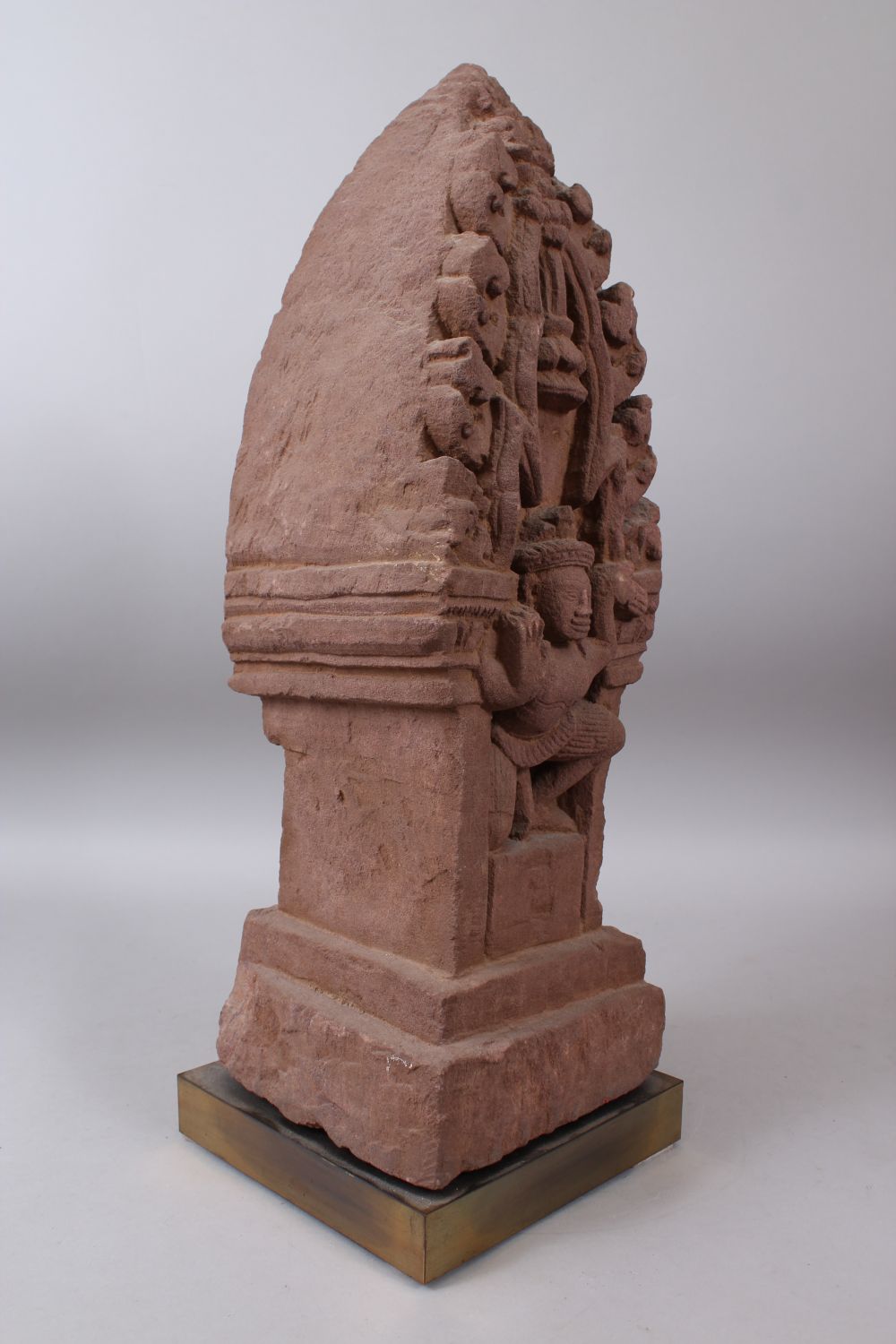 A CAMBODIAN KHMER STYLE CARVING OF A CROUCHING FIGURE IN A TEMPLE. - Image 4 of 6