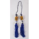 A SET OF 19TH / 20TH CENTURY CHINESE REVERSE PAINTED GLASS DROPS, the tassel set with two glass