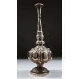 A GOOD 19TH CENTURY INDIAN SILVER ROSE WATER SPRINKLER, with embossed floral decoration 24cm high.