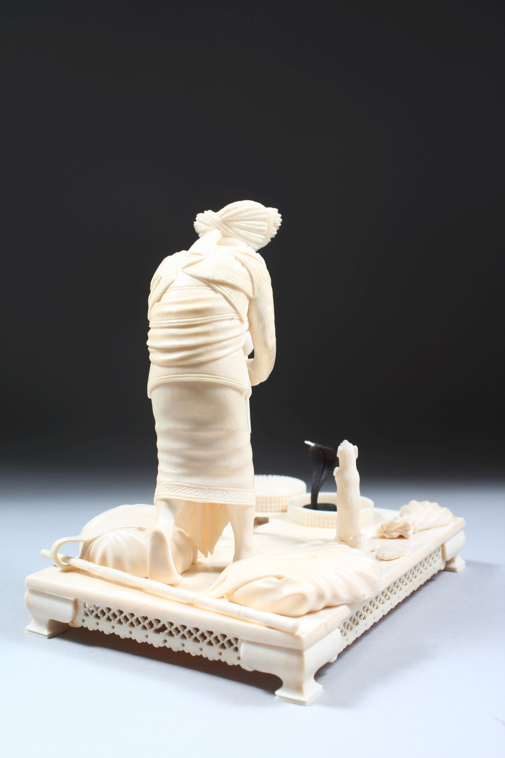 A 19TH CENTURY CARVED INDIAN IVORY MODEL OF A SNAKE CHARMER, the man stood over two snakes with a - Image 4 of 8