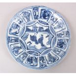 A GOOD CHINESE WANLI PERIOD BLUE & WHITE KRAAK PORCELAIN PLATE, decorated with scenes figures in