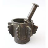 A RARE 13TH/14TH CENTURY ISLAMIC SPANISH NASRID BRONZE PESTLE AND MORTAR, the mortar with eight