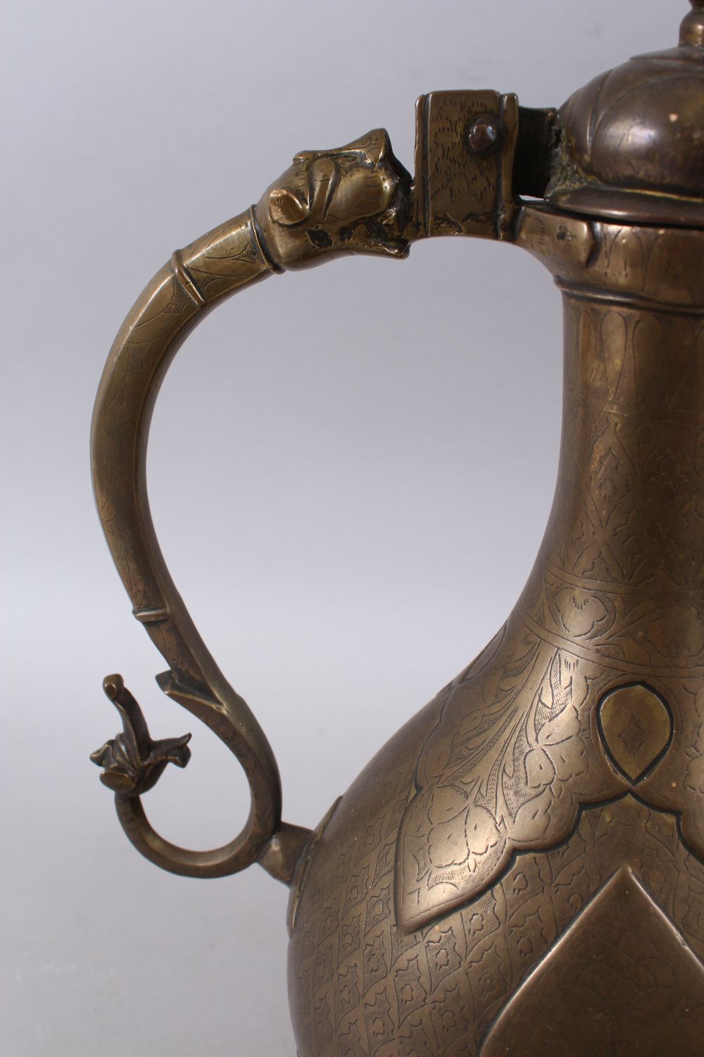 A LARGE 18TH CENTURY MUGHAL INDIAN BRONZE EWER, with carved and moulded decoration to the body, 37. - Image 4 of 6