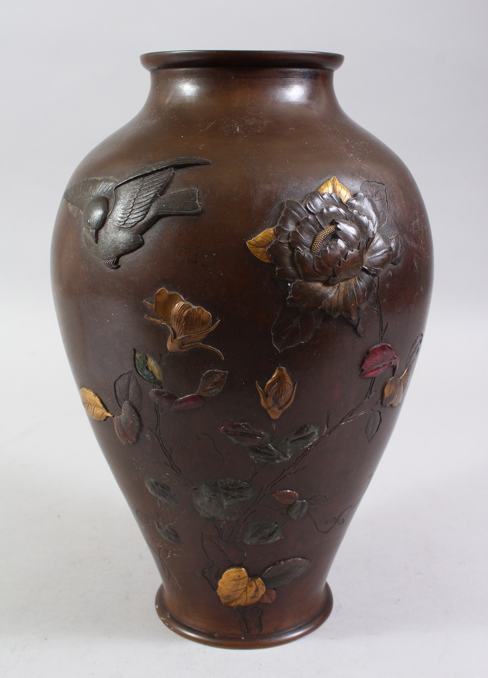 A JAPANESE MEIJI PERIOD BRONZE & MIXED METAL VASE, the body of the vase with on laid decoration