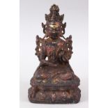 A GOOD EARLY CHINESE BRONZE BUDDHA / DEITY, in a seated position on a lotus base, holding a fruit or