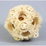 A 19TH CENTURY CHINESE CARVED IVORY PUZZLE BALL, with reticulated balls with carved decoration