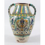 AN EARLY 20TH CENTURY NORTH AFRICAN TUNISIAN POTTERY JAR SIGNED CHEMLE, with twin moulded handles,