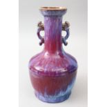 A GOOD CHINESE TWIN HANDLE FLAMBE PORCELAIN VASE, the vase with twin moulded chi long handles, the