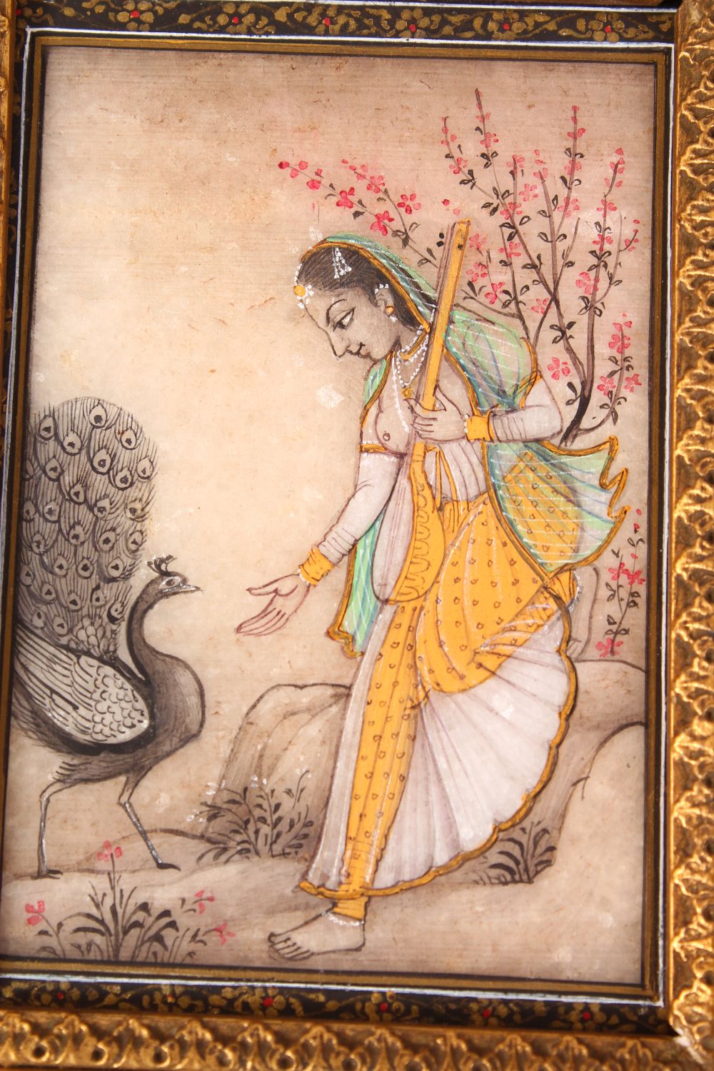 INDIAN SCHOOL, A FEMALE FIGURE HOLDING A MAGICAL INSTRUMENT, A PEACOCK BY HER SIDE, painted on a - Image 4 of 6