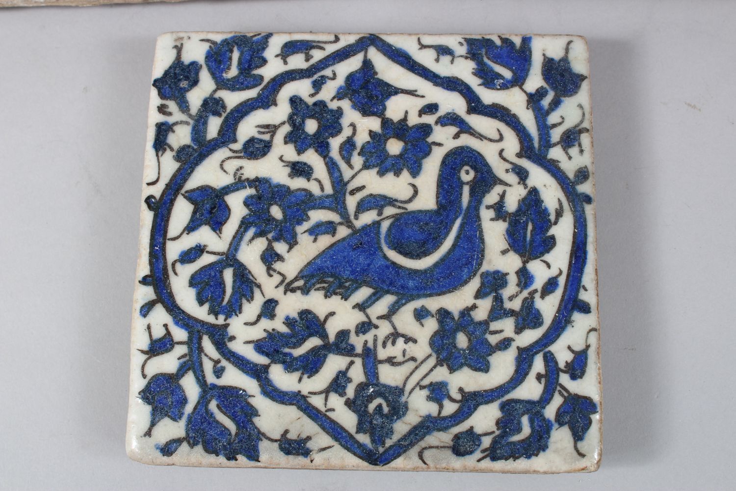 THREE 18TH/19TH CENTURY PERSIAN TILES, each decorated with birds amongst foliage, 15.5cm x 15.5cm - Image 4 of 5