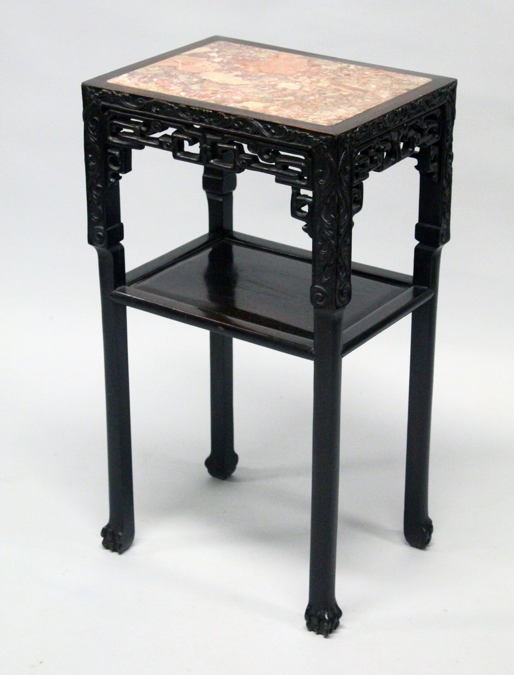 A 19TH CENTURY CHINESE HARDWOOD MARBLE TOP TWO TIER STAND, the stand with carved decoration, 46cm