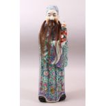 A GOOD CHINESE REPUBLIC PERIOD FAMILLE ROSE PORCELAIN FIGURE OF AN IMMORTAL AND BOY, the figure