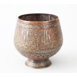 A SMALL ISLAMIC PEDESTAL BOWL, with engraved and inlaid decoration, 8cm high.