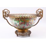 A LARGE 19TH CENTURY CHINESE CANTON FAMILLE ROSE PORCELAIN BOWL, the bowl with panel decoration