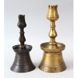 TWO EARLY OTTOMAN BRONZE CANDLESTICKS, 23.5cm and 20cm high (2).