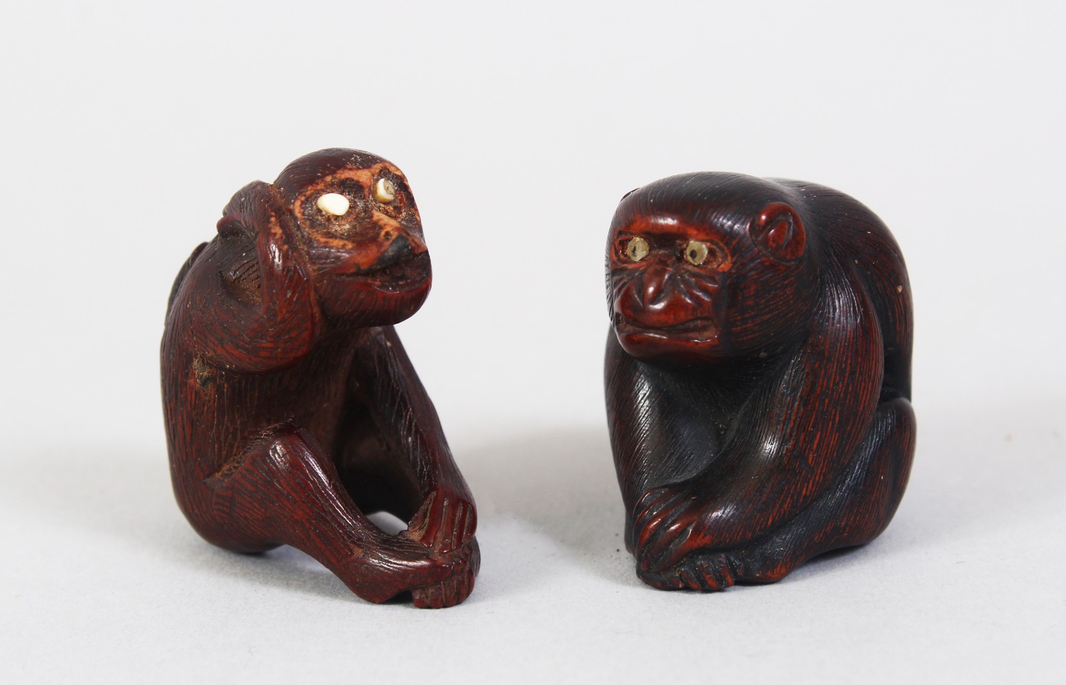 TWO GOOD JAPANESE MEIJI PERIOD CARVED WOODEN NETSUKE OF MONKEYS, both monkeys in seated positions