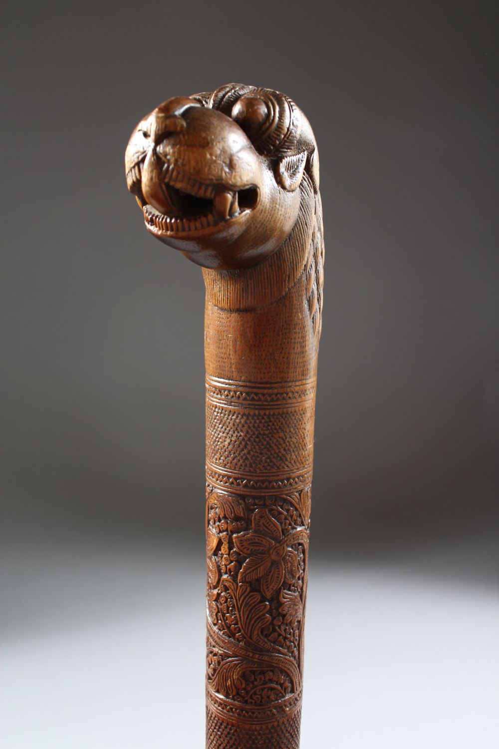 A 19TH CENTURY INDIAN CARVED SANDAL WOOD MAYSORE WALKING STICK, 87cm.