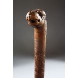 A 19TH CENTURY INDIAN CARVED SANDAL WOOD MAYSORE WALKING STICK, 87cm.