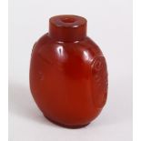 A GOOD 19TH / 20TH CENTURY CHINESE AMBER GLASS SNUFF BOTTLE, with carved handles to the sides, no