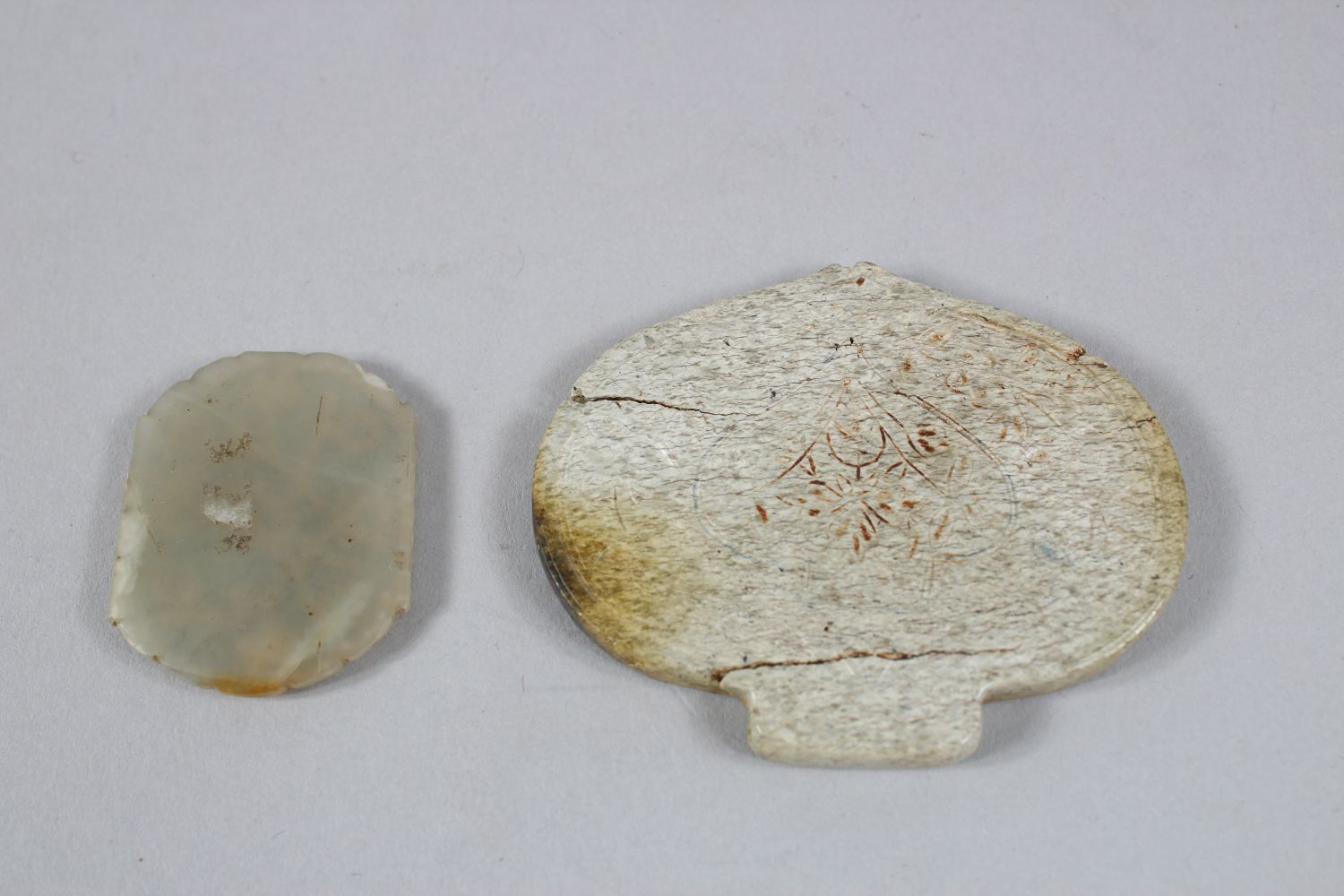 TWO INDIAN CARVED JADE PLAQUES, one plaque with inset gems, and gilding, 6.5cm & 3.5cm. - Image 2 of 5