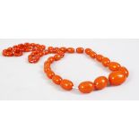 A SET OF 19TH / 20TH CENTURY CHINESE AMBER ROSARY BEAD NECKLACE, comprising of 62 graduating size