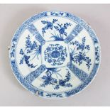 A 19TH CENTURY CHINESE BLUE & WHITE PORCELAIN PLATE, with panels of floral decoration, with a