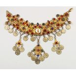 A GOOD INDIAN GILT METAL NECKLACE, mounted with semi precious stones, coins and a small circular
