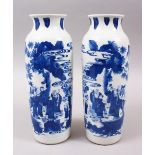 A PAIR OF 19TH / 20TH CENTURY CHINESE BLUE & WHITE PORCELAIN VASES, each vase decorated in a similar
