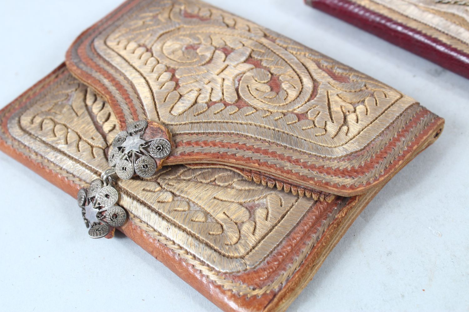 TWO OTTOMAN SILVER THREAD DECORATED LEATHER WALLETS, one dated 1908, 14cm and 10cm wide, (2). - Image 3 of 6