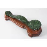 A GOOD 19TH / 20TH CENTURY CHINESE CARVED JADE / JADE LIKE RUYI SCEPTRE ON STAND, the ruyi sceptre