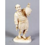 A JAPANESE MEIJI PERIOD CARVED IVORY OKIMONO OF A FISHERMAN, the small okimono depicting a fisherman