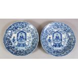 A PAIR OF UNUSUAL CHINESE KANGXI PERIOD BLUE & WHITE PORCELAIN DISHES, the decoration very unusual