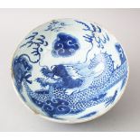 AN 18TH CENTURY CHINESE BLUE & WHITE PORCELAIN BOWL, decorated with scenes of a dragon amongst
